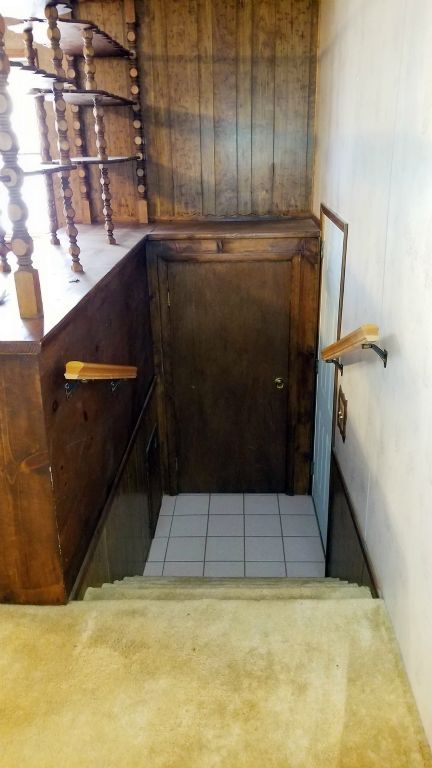 Stairs leading to Attache Double Garage from Den